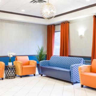 A vibrant and inviting lounge area featuring colorful seating arrangements.