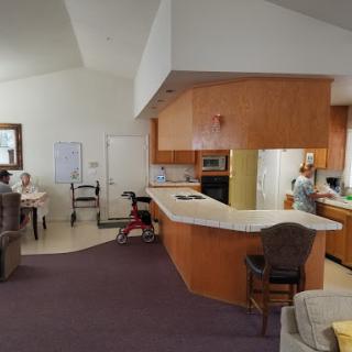 A spacious and modern open-concept kitchen and living area with comfortable seating.