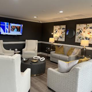 A stylish and inviting living room setup featuring contemporary furniture and decorative artwork.