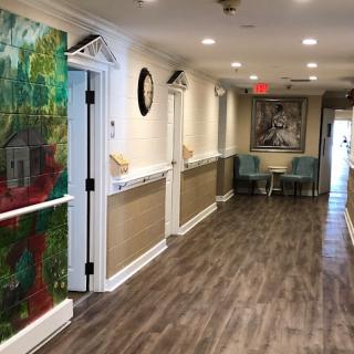 A vibrant hallway featuring colorful artwork and modern decor.