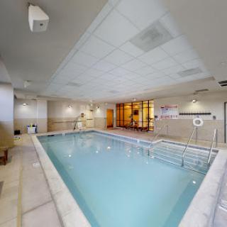 A serene indoor swimming pool designed for relaxation and wellness.