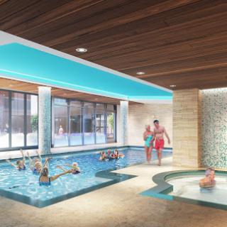 A serene indoor pool area featuring a spa, perfect for relaxation and wellness.