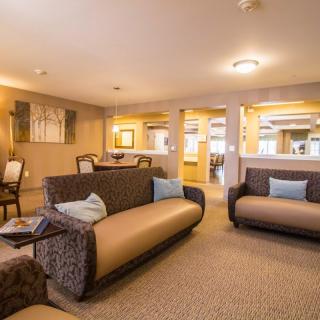 A modern and spacious living room with comfortable sofas and elegant interior design.