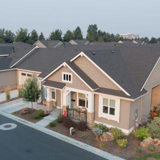 Aerial view of a suburban house in a residential neighborhood.