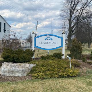 Welcome to the neighborhood: A community sign amidst a tranquil landscape.