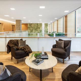 A modern lounge area with comfortable seating and a stylish coffee table.