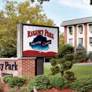 Exterior view of a building with a sign labeled 'Regency Park'.