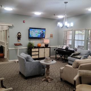 A cozy living room with comfortable seating and a television.