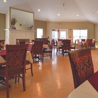 A cozy dining area with neatly arranged tables and chairs.