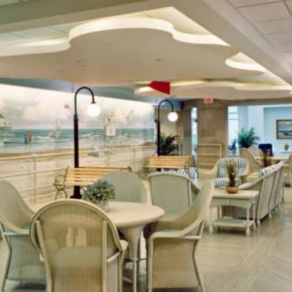 A cozy indoor cafe with seating arrangements and decorative elements.