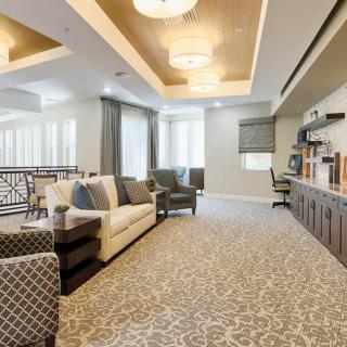 A modern and elegantly designed lounge area with comfortable seating and stylish lighting.
