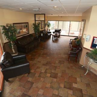 Spacious lobby with seating and natural light.