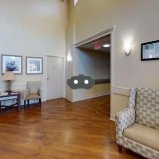 A cozy lobby area with seating and decor.