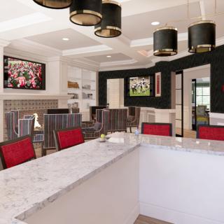 Modern kitchen with sleek countertops and stylish lighting fixtures.