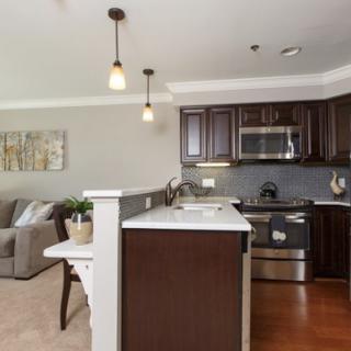 A contemporary kitchen featuring modern appliances and stylish decor.