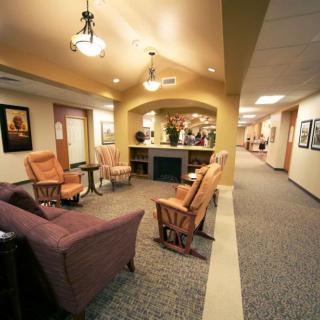 A warmly lit lobby featuring comfortable seating and decorative elements.