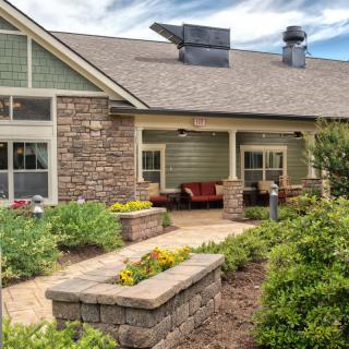 A charming residential house with beautiful landscaping and garden.