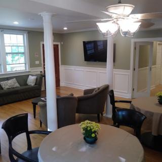 A cozy living room with comfortable seating, a TV, and stylish decor.