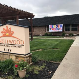 A community center named 'Eaglewood' featuring a welcoming sign and a colorful banner.