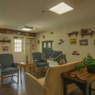 A cozy living room with vintage decor and comfortable seating.