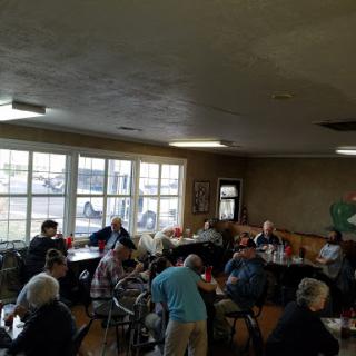 A cozy dining space filled with people enjoying a meal together.