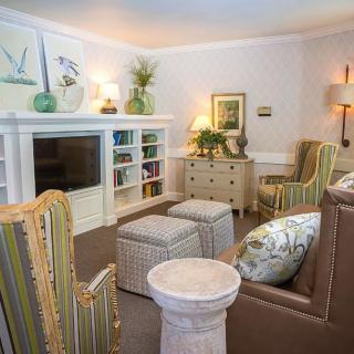 A cozy living room with elegant furniture and a bright, inviting atmosphere.