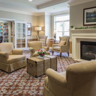 A cozy living room with comfortable seating and a fireplace.