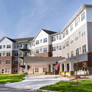 A modern residential building with multiple floors, likely designed for senior living.
