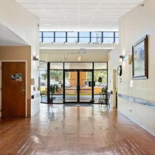 A bright hallway with glass doors and natural light.