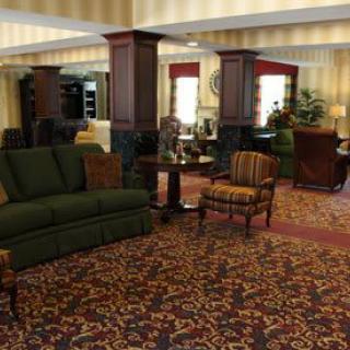 A well-decorated lobby with comfortable seating and elegant furnishings.