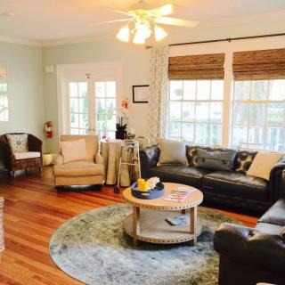 A cozy living room with comfortable seating and natural lighting.