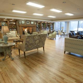 A spacious living room with elegant furniture and large windows.