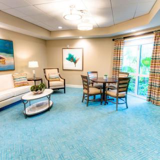 A cozy living room with comfortable seating and bright decor.