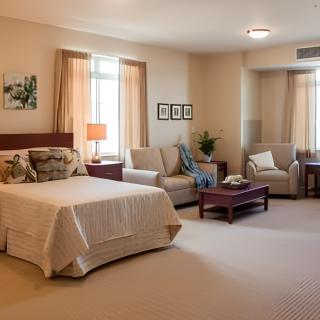 A cozy bedroom with a bed, sofa, and stylish decor.