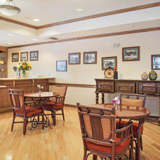 A cozy dining area with wooden furniture and decor.