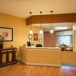 A welcoming reception area featuring modern decor and warm colors.