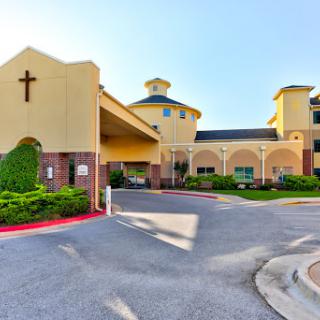 The welcoming entrance of a hospitality establishment featuring distinct architectural elements.