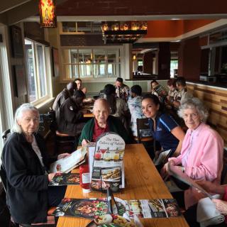A group of people dining together at a restaurant.
