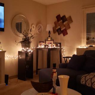 A cozy living room adorned with warm lighting and modern decor.