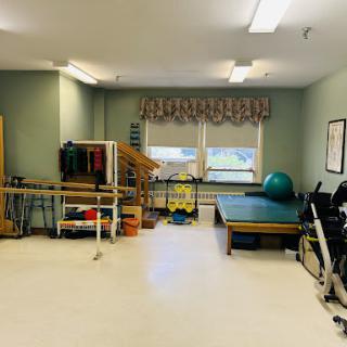 A well-equipped physical therapy room designed for rehabilitation and exercise.