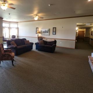 Spacious living area with comfortable seating and natural lighting.