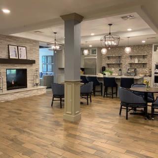 A spacious open-concept living room and kitchen with modern decor.