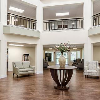 A modern and spacious lobby area with elegant furniture and decor.