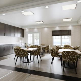 A modern dining area with stylish furniture and ample natural light.