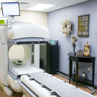 An MRI machine is set up in a well-decorated healthcare environment.