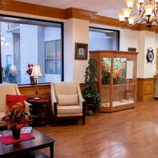 A cozy lobby with seating, decor, and elegant lighting.