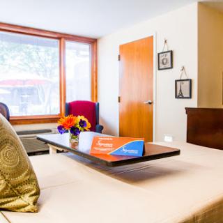 A stylish hotel room with modern decor and a cozy atmosphere.