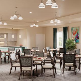 A modern dining area with multiple tables and chairs, featuring stylish lighting and a decorative artwork on the wall.