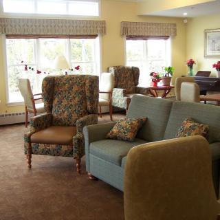 A cozy living room with comfortable seating and natural light.