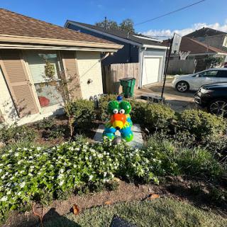 A vibrant inflatable decoration adds a playful touch to the garden.